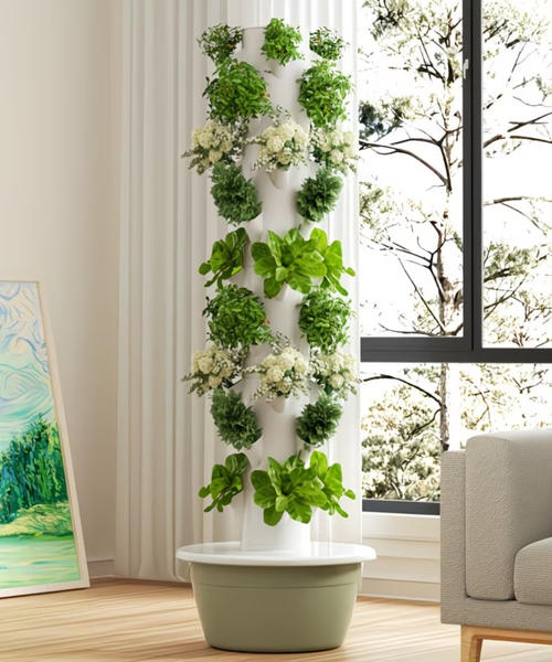 Tour de culture hydroponique à bac vert installée dans un salon lumineux avec salades et aromates