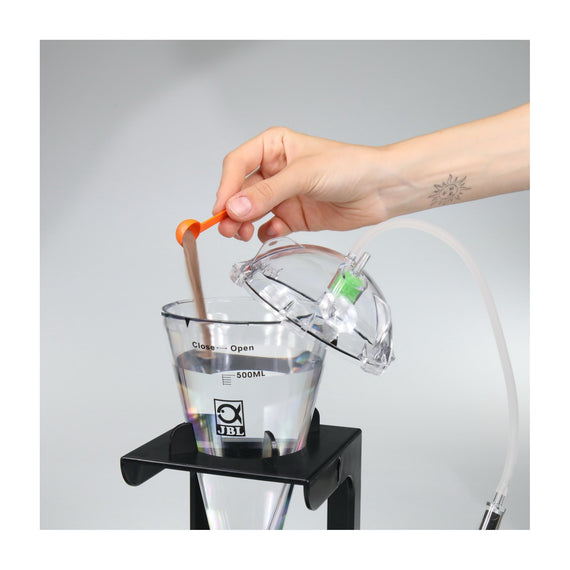 JBL brine shrimp eggs poured into a hatchery using the measuring spoon