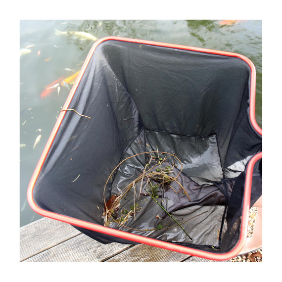 Fine mesh of the JBL pond net catching leaves and plant debris